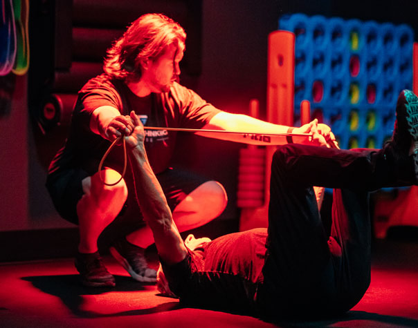 Woman working out with Help of a trainer