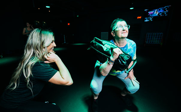 Woman working out with Help of a trainer